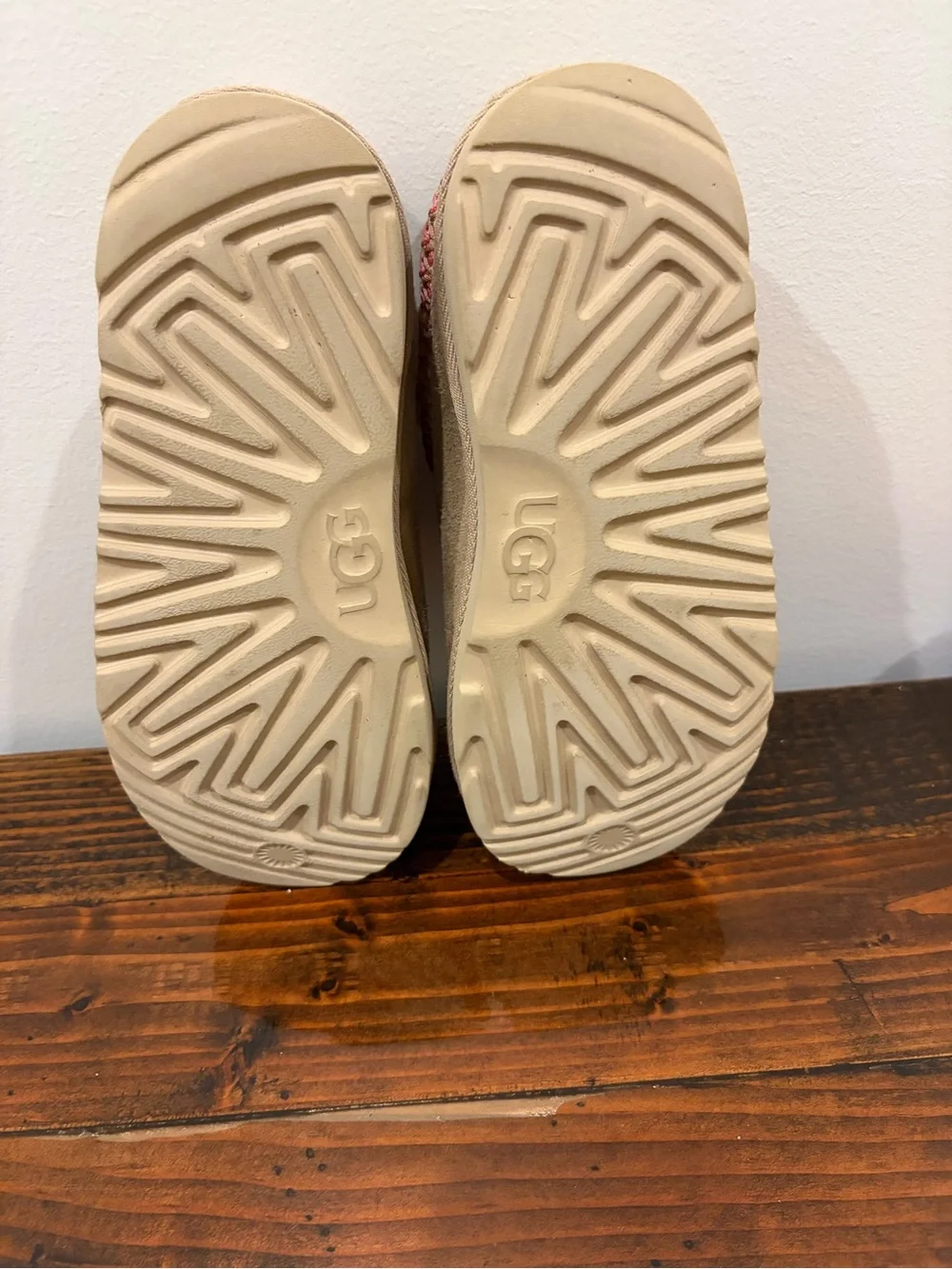UGG Kids Slip-On Suede Slippers in Tan with Pink Trim
